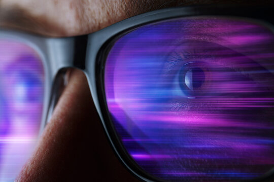 Woman wears smart glass reflecting bright neon cyberspace light