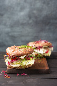 Veggie Burger, vegan, with salad, radish, tomato, rock chive