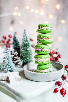 Stack of green macaroons and Christmas decorations