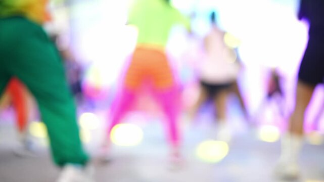 Abstract Motion Blur of People Dancing and Exercising Outdoors in Public Park for Dynamic Background and Wellness Concept