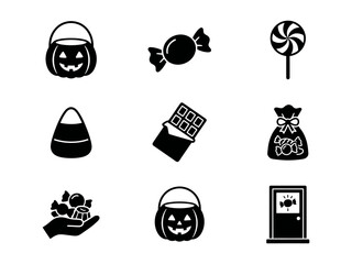 Set of black halloween trick or treat icons with pumpkin buckets candies and sweets collection © alien AZ