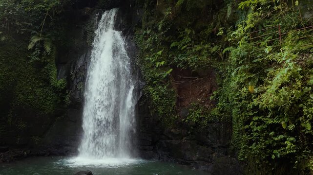 Ulu Petanu waterfall in Ubud, Bali Indonesia. Cinematic. Green vegetation and rocks. Cascades of water. 