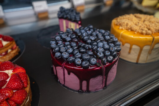 Blueberry Chocolate Drip Cake In Display Close Up
