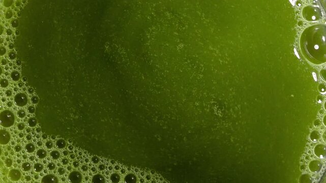 Top view close-up of green matcha tea foam antioxidant detox healthy drink
