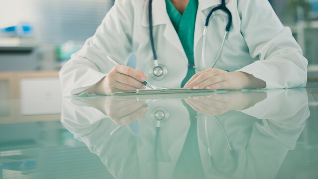 Medical doctor completing administrative healthcare records
