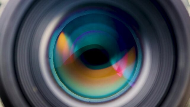 Close-up macro shot of a camera lens aperture smoothly closing from its widest to its narrowest setting, showcasing the precision of optical mechanics and exposure control