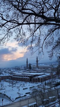Aerial Sunrise View of Snow Covered Bursa City with Grand Mosque (Ulu Cami), Turkey in Winter