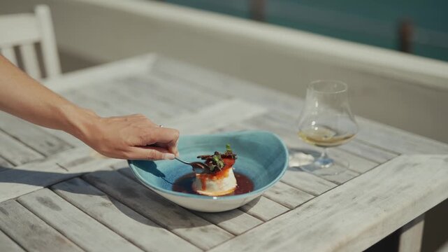 Close-up of delicious appetizer with glass of white wine on table