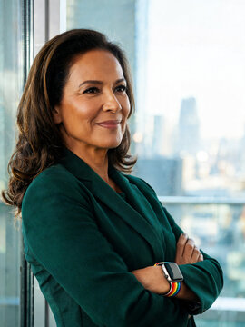 Confident Latina Corporate Executive in High Rise Office
