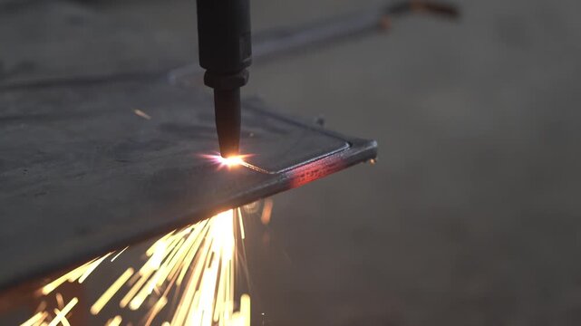 Experienced Machinist Cutting Steel with Industrial Metal Cutting Machine in Local Engineering Workshop	