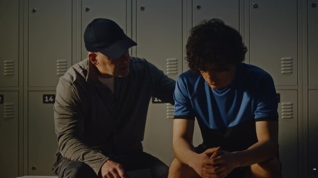 Serious Conversation Between Youth Football Coach and Disappointed Teenage Boy. Reality of Youth Athletics Pressure to Perform and Vital Role of Positive Role Model in Overcoming Failure. Mentorship.