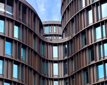 Closeup view of the organic, interconnected geometry and expansive glass fa&ccedil;ades of Axel Towers, a striking contemporary office complex in Copenhagen, Denmark.