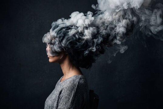 A young woman sitting in profile with thick, swirling gray smoke forming a cloud around her head, symbolizing confusion, stress, or a wandering mind against a dark backdrop.