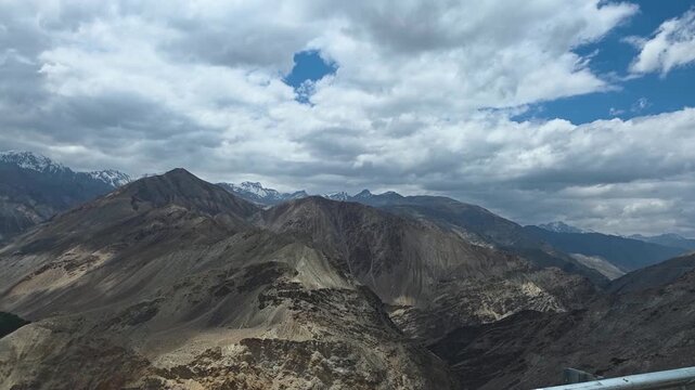 Rocky Hills and Green Slopes Along the Mountain Route
