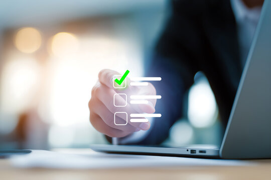 The business person is pressing the checkboxes to check the correct information on the checklist.