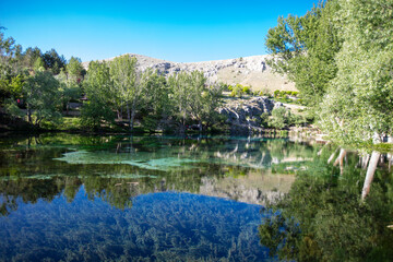 Fototapeta premium Crystal Clear Waters of Gokpinar Lake in Gurun Sivas Turkey Surrounded by Natural Landscape