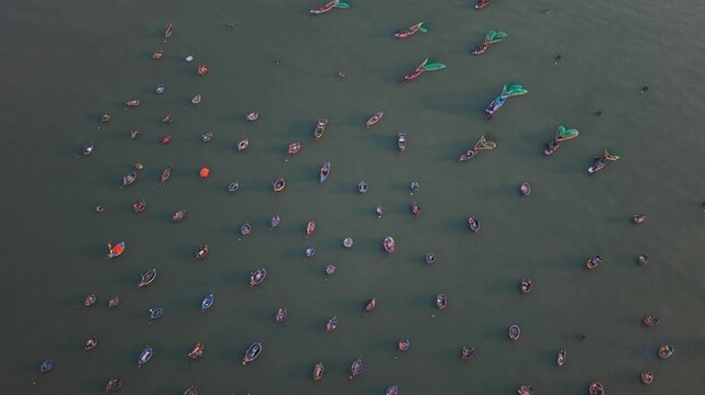 Vietnam, Da Nang Anchored Boats Create Serene Water Design. Round Fishing Vessels Create Peaceful Water Landscape. Traditional Floating Coracles Establish Repetitive Pattern Over Tranquil