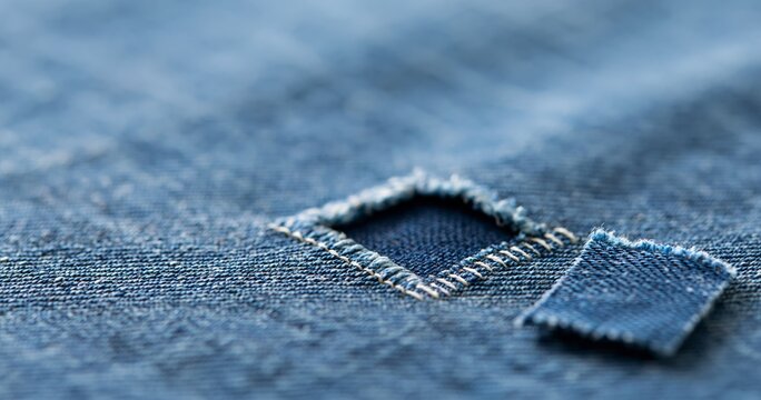 Close-up of denim fabric patch repair
