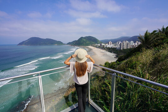 Tourist woman enjoying view from belvedere in Guaruja, Sao Paulo State, Brazil