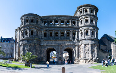 Naklejka premium Trier, Germany - 9 May 25: Panoramic Front View of Porta Nigra in Trier