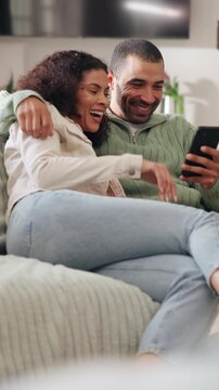 Relax, cuddle and couple with phone on couch, share social media post or watch funny video together. Bonding, support and happy people with mobile app for internet meme, laughing and chill in home