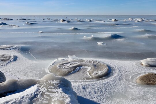 frozen Baltic Sea coast with pancake ice structures in Kabli