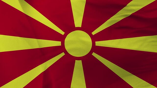 North Macedonian flag fabric with yellow sun rays on red background