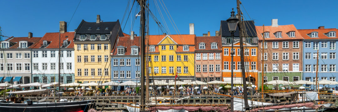 Panorama of the famous colorful Nyhavn Harbor (or New Port), Copenhagen panoramic cityscape, Denmark  header