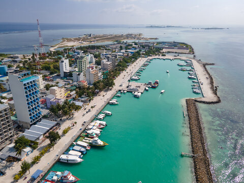 Aerial drone view of Maafushi, one of the inhabited islands of Kaafu Atoll in the Maldives. Maafushi island is popular for budget travel in Maldives.