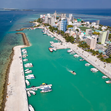 Aerial drone view of Maafushi, one of the inhabited islands of Kaafu Atoll in the Maldives. Maafushi island is popular for budget travel in Maldives.
