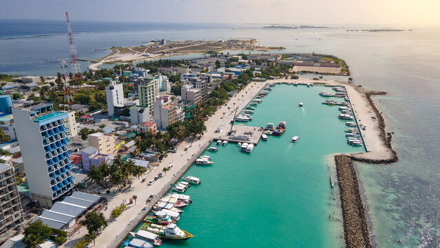 Aerial drone view of Maafushi, one of the inhabited islands of Kaafu Atoll in the Maldives. Maafushi island is popular for budget travel in Maldives.