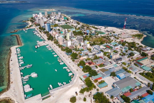 Aerial drone view of Maafushi, one of the inhabited islands of Kaafu Atoll in the Maldives. Maafushi island is popular for budget travel in Maldives.