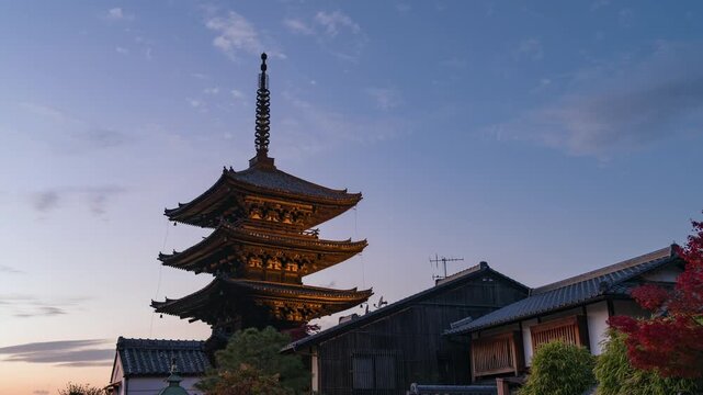 Dusk to night timelapse of the historic Gion district during autumn season in Kyoto, Japan, zooming out.