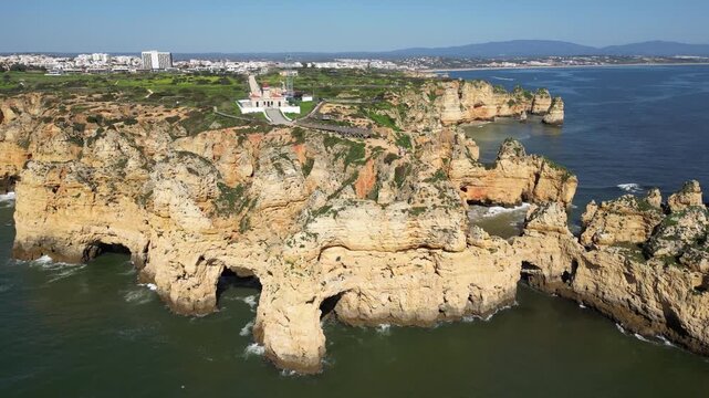 Drone Aerial View of Ponta da Piedade Coastline in Lagos, Algarve, Portugal with Boat Tours on a Summer Day