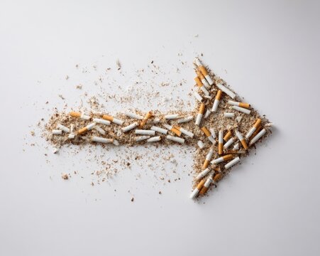 Broken cigarette arranged into upward arrow symbolizing positive change, clean white backdrop