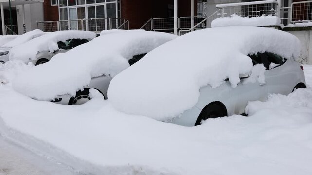 Cars Completely Covered in Snow After Blizzard, Heavy Snowfall and Extreme Winter Weather Conditions