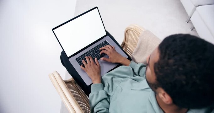 Overhead View of Man Using Laptop with Blank Screen at Home