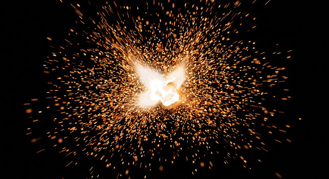 Instant micro spark flash blast with flying ember particles on black
