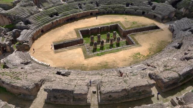 Aerial Drone view of the Amphitheatre of the Roman city of Italica, Ancient Ruins near to Seville, Sevilla, Spain
