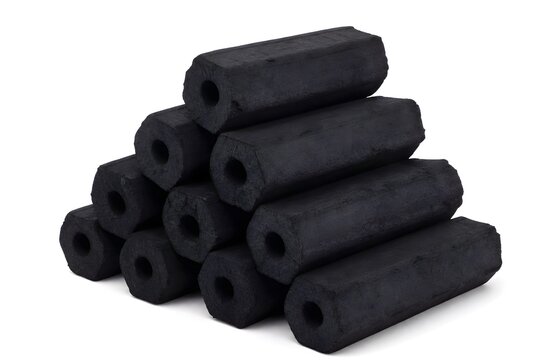 Hexagonal briquette charcoal stack on white background.