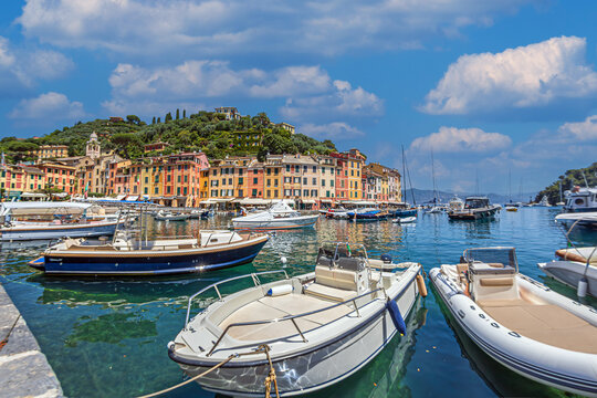 Portofino Square, Province of Genoa, Italy, a tourist attraction. The area is small, but it concentrates pastel-colored buildings, opening onto the sea, chic terraces and a refined Mediterranean air.