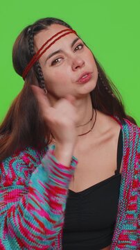 Quarrel. Displeased young woman gesturing hands with irritation and displeasure, blaming scolding for failure, asking why this happened. Hippie lady isolated on chroma key background, green screen