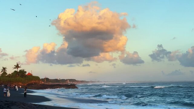 Scenic view of Seseh Beach in Bali, Indonesia, featuring volcanic black sand, rolling Indian Ocean waves, and a peaceful tropical coastline.