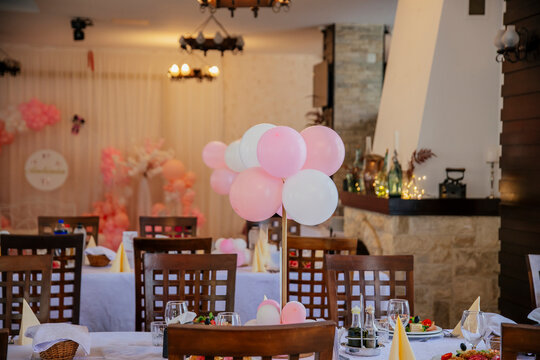 Wedding reception table with pink balloons