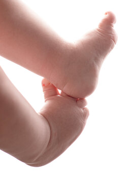 baby feet over white background