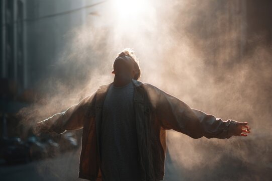 Person standing in sunlight with smoke-free clear air around