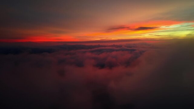 Aerial Drone Above Red Cloud Sea with Orange Sunset Horizon