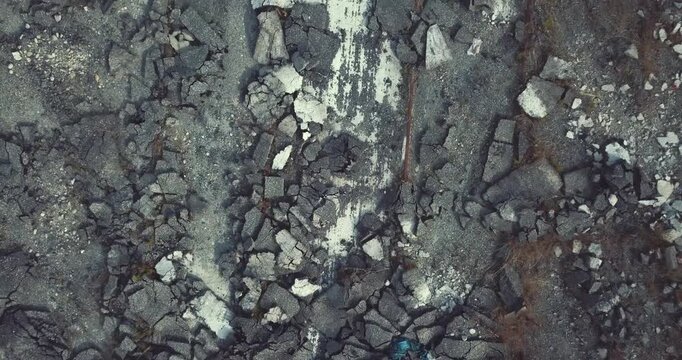 Cracked rocky ground texture with scattered stone fragments