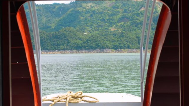 Boat journey through Ngoi Hoa Bay between karst mountains, Hoa Binh, Vietnam