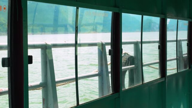 Boat journey through Ngoi Hoa Bay between karst mountains, Hoa Binh, Vietnam